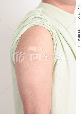 Adult Man with bandage after received vaccine. Vaccination and Immunization for Influenza, HPV, Zoster, IPD, DTP or Diphtheria, Tetanus and Pertussis, MMR, Hepatitis B, Covid and Varicella vaccine Adult Man with bandage after received vaccine. Vaccination and Immunization for Influenza, HPV, Zoster, IPD, DTP or Diphtheria, Tetanus and Pertussis, MMR, Hepatitis B, Covid and Varicella vaccine 127629670