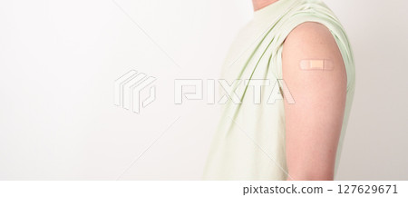 Adult Man with bandage after received vaccine. Vaccination and Immunization for Influenza, HPV, Zoster, IPD, DTP or Diphtheria, Tetanus and Pertussis, MMR, Hepatitis B, Covid and Varicella vaccine Adult Man with bandage after received vaccine. Vaccination and Immunization for Influenza, HPV, Zoster, IPD, DTP or Diphtheria, Tetanus and Pertussis, MMR, Hepatitis B, Covid and Varicella vaccine 127629671