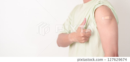 Adult Man with bandage after received vaccine. Vaccination and Immunization for Influenza, HPV, Zoster, IPD, DTP or Diphtheria, Tetanus and Pertussis, MMR, Hepatitis B, Covid and Varicella vaccine Adult Man with bandage after received vaccine. Vaccination and Immunization for Influenza, HPV, Zoster, IPD, DTP or Diphtheria, Tetanus and Pertussis, MMR, Hepatitis B, Covid and Varicella vaccine 127629674