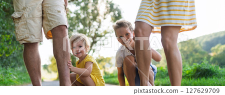 Banner of family with small children in sunny summer nature. 127629709
