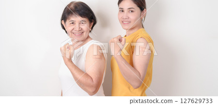 Adult and Elderly Woman with bandage after received vaccine. Vaccination and Immunization for Influenza, HPV, Zoster, IPD, DTP, Dengue, Encephalitis, Rabies, Pneumococcal Hepatitis B and Covid vaccine Adult and Elderly Woman with bandage after received vaccine. Vaccination and Immunization for Influenza, HPV, Zoster, IPD, DTP, Dengue, Encephalitis, Rabies, Pneumococcal Hepatitis B and Covid vaccine 127629733