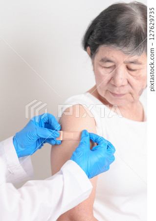 Elderly Woman with bandage after received vaccine. Vaccination and Immunization for Influenza, Herpes Zoster, Tetanus, Covid 19 booster, Dengue, Encephalitis, Rabies, Pneumococcal, IPD, RSV Vaccines Elderly Woman with bandage after received vaccine. Vaccination and Immunization for Influenza, Herpes Zoster, Tetanus, Covid 19 booster, Dengue, Encephalitis, Rabies, Pneumococcal, IPD, RSV Vaccines 127629735