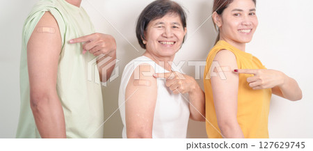 Adult and Senior group with bandage after received vaccine. Vaccination and Immunization for Influenza, HPV, Zoster, IPD, DTP, Dengue, Encephalitis, Rabies, Pneumococcal Hepatitis B and Covid vaccines 127629745