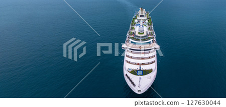Aerial view luxury ocean cruise ship on clam blue sea, Elegant modern travel lifestyle, Luxury cruise ship liner modern maritime business ocean tourism, Global business cruise ship liner industry. 127630044