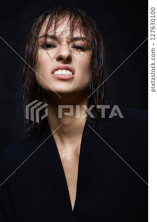 Angry young woman with Wet Hair. grimacing Beautiful girl portrait Angry young woman with Wet Hair. grimacing Beautiful girl portrait 127630100