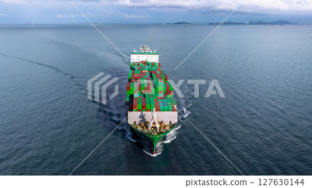 Fully loaded container cargo ship at sea, Global logistic maritime freight transport, Container cargo ship freight shipping international import export logistic sea freight container cargo shipping. 127630144