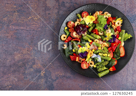 Delicious fresh salad with prawns and vegetables. 127630245