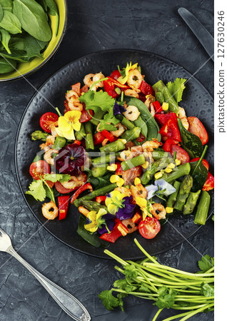 Delicious fresh salad with prawns and vegetables. 127630246