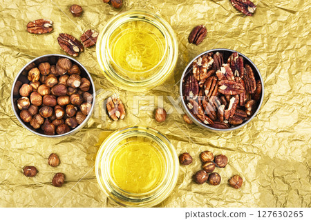 Glass with nut oil. Glass with nut oil. 127630265