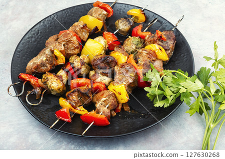 Grilled pork skewers with vegetables. Grilled pork skewers with vegetables. 127630268