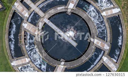 Aerial view westewater treatment tank with wastewater, Circle circular water clarifier cleaning water, Circle water treatment plant circular clarifier, Water treatment plant. 127630315