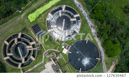 Aerial view westewater treatment tank with wastewater, Circle circular water clarifier cleaning water, Circle water treatment plant circular clarifier, Water treatment plant. Aerial view westewater treatment tank with wastewater, Circle circular water clarifier cleaning water, Circle water treatment plant circular clarifier, Water treatment plant. 127630467