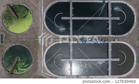 Aerial view westewater treatment tank with wastewater, Circle circular water clarifier cleaning water, Circle water treatment plant circular clarifier, Water treatment plant. 127630468