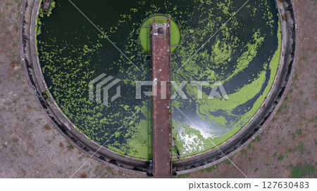 Aerial view westewater treatment tank with wastewater, Circle circular water clarifier cleaning water, Circle water treatment plant circular clarifier, Water treatment plant. 127630483