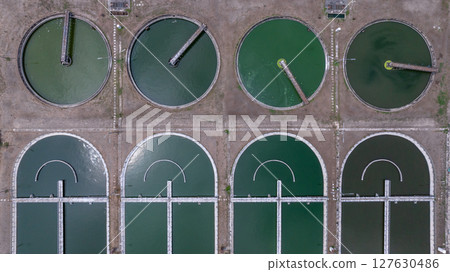 Aerial view westewater treatment tank with wastewater, Circle circular water clarifier cleaning water, Circle water treatment plant circular clarifier, Water treatment plant. 127630486