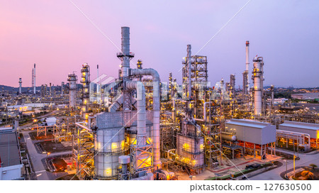 Aerial view oil and gas refinery plant at night, Global business energy logistic transportation, Oil and gas refinery petrochemical industrial, Petrochemical refinery industrial energy supply chain. 127630500