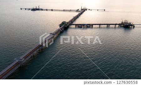 Aerial view industrial oil and gas pipeline system, Energy industry pipeline structure oil and gas refinery, Industrial pipeline system petrochemical plant refinery, Petrochemical pipeline network. 127630558