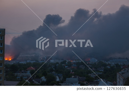 Black smoke from explosion in Kyiv, Ukraine. Russian invasion to Ukraine. Missile attack in Kyiv. Kyiv cityscape in fire, view from window. War in Ukraine. Russian aggression in Ukraine. Black smoke from explosion in Kyiv, Ukraine. Russian invasion to Ukraine. Missile attack in Kyiv. Kyiv cityscape in fire, view from window. War in Ukraine. Russian aggression in Ukraine. 127630835