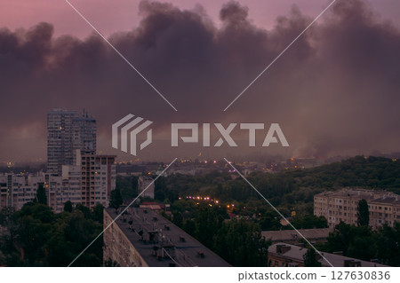 Black smoke from explosion in Kyiv, Ukraine. Russian invasion to Ukraine. Missile attack in Kyiv. Kyiv cityscape in fire, view from window. War in Ukraine. Russian aggression in Ukraine. Black smoke from explosion in Kyiv, Ukraine. Russian invasion to Ukraine. Missile attack in Kyiv. Kyiv cityscape in fire, view from window. War in Ukraine. Russian aggression in Ukraine. 127630836
