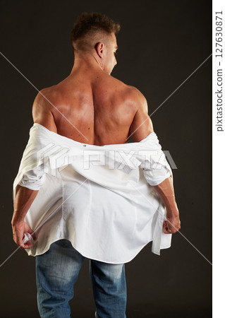 male model - fitness addicted shot in studio background 127630871