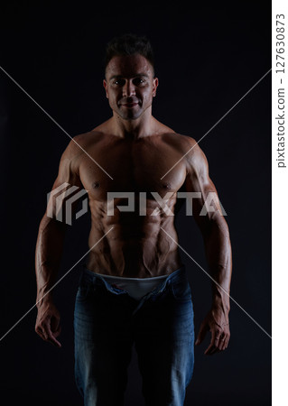 male model - fitness addicted shot in studio background 127630873
