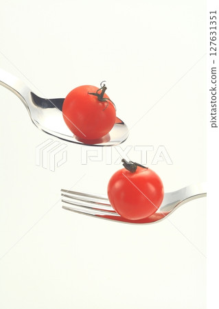 Fork, spoon, cherry tomato Fork, spoon, cherry tomato 127631351