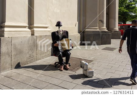 June 12, 2025 Munich, Germany. A headless street musician was playing on the streets of Munich June 12, 2025 Munich, Germany. A headless street musician was playing on the streets of Munich 127631411