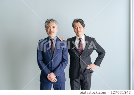Group of smiling middle-aged male business people Group of smiling middle-aged male business people 127631542