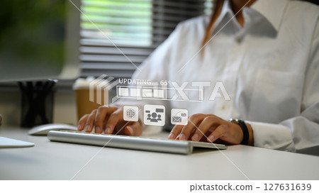 Businesswoman managing software update, symbolizing productivity and digital workflow 127631639