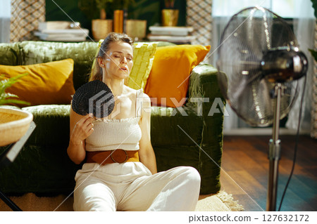 Woman Finds Relief from Summer Heat Indoors Woman Finds Relief from Summer Heat Indoors 127632172