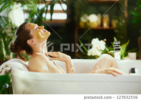Tranquil Side Profile: Woman in Spa Bath 127632556