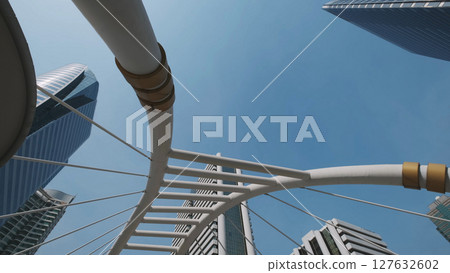 Walkway bridge arch and skyscrapers in Bangkok 127632602