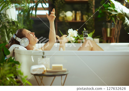 Woman Singing Energetically in Luxurious Bath Woman Singing Energetically in Luxurious Bath 127632626