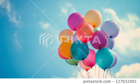 Colorful balloons against a blue sky. Colorful balloons against a blue sky. 127632891