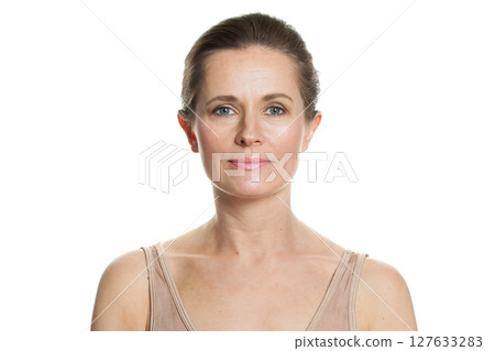 Cute mid aged mature woman looking at camera and smiling. 127633283