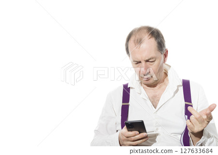 Portrait of a sixty-year-old man in a white shirt. 127633684