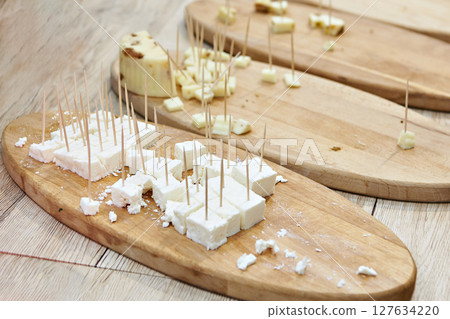 Cheese pieces for sampling 127634220