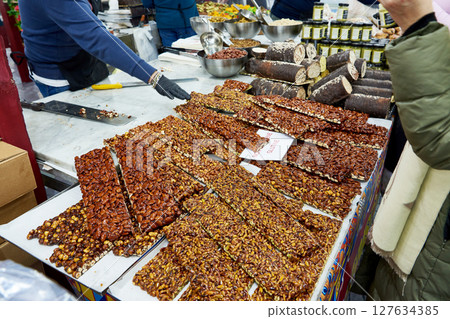 Caramelized nuts gozinaki in market 127634385