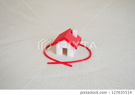 The house is outlined in red. Choice of housing. The house is outlined in red. Choice of housing. 127635514