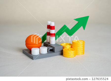 Industrial plant with stacks of money coins and green arrow pointing up. Chemical production income. 127635524