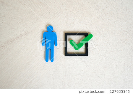 Man and green check mark. Recruitment success, performance recognition, or personal achievement 127635545