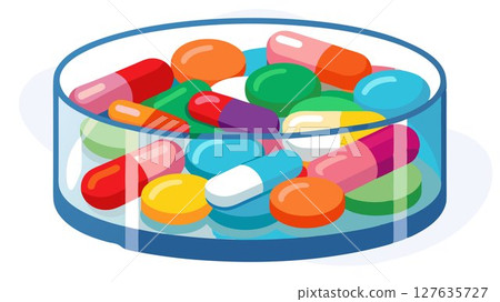 This image features an array of colorful pills and capsules neatly arranged in a transparent container, isolated for clarity and impact, making it an ideal visual for pharmaceutical advertising, medi 127635727