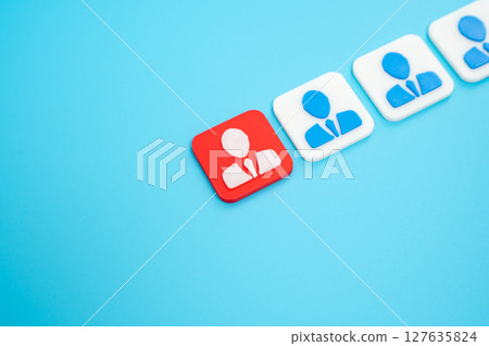 The employee highlighted in red among others. Staff reduction, dismissal. Job insecurity 127635824