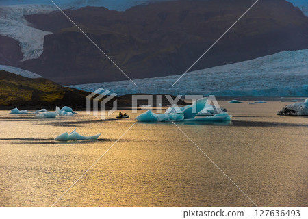 Glacier and icebergs in Fjallsarlon Glacial Lagoon, Iceland. Great tourist attraction Glacier and icebergs in Fjallsarlon Glacial Lagoon, Iceland. Great tourist attraction 127636493