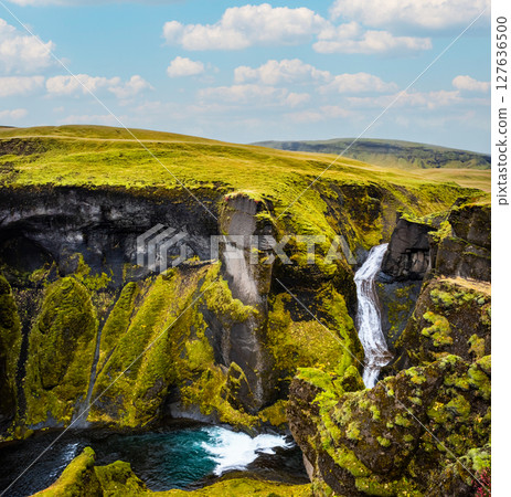 Unique landscape of Fjadrargljufur in Iceland. Top tourism destination. Fjadrargljufur Canyon is a massive canyon about 100 meters deep, located in South East of Iceland. Unique landscape of Fjadrargljufur in Iceland. Top tourism destination. Fjadrargljufur Canyon is a massive canyon about 100 meters deep, located in South East of Iceland. 127636500