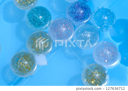 A refreshing image of a super ball floating on water 127636712