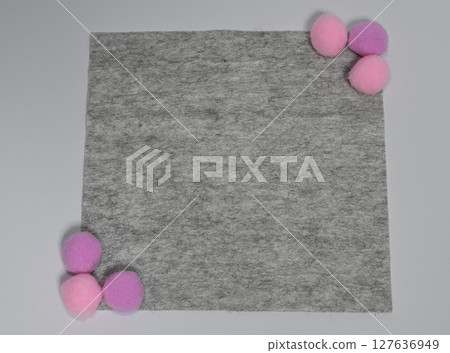 Grey felt and pom-pom decorations 127636949