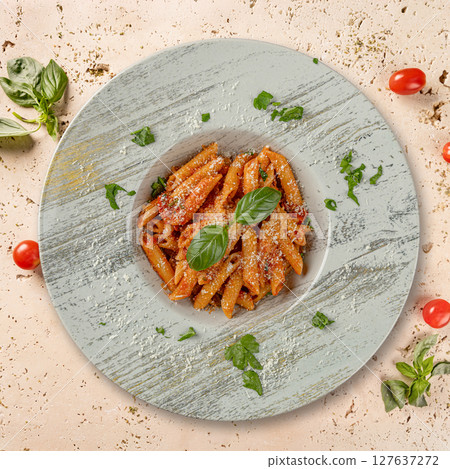 Penne pasta with tomato sauce 127637272
