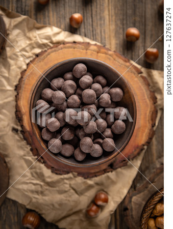 Chocolate covered hazelnuts Chocolate covered hazelnuts 127637274