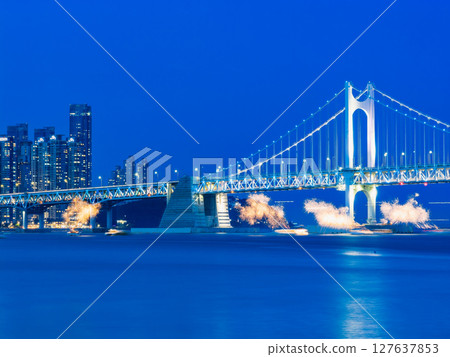 Busan: Illuminated Gwangan Bridge and fireworks on a boat Busan: Illuminated Gwangan Bridge and fireworks on a boat 127637853